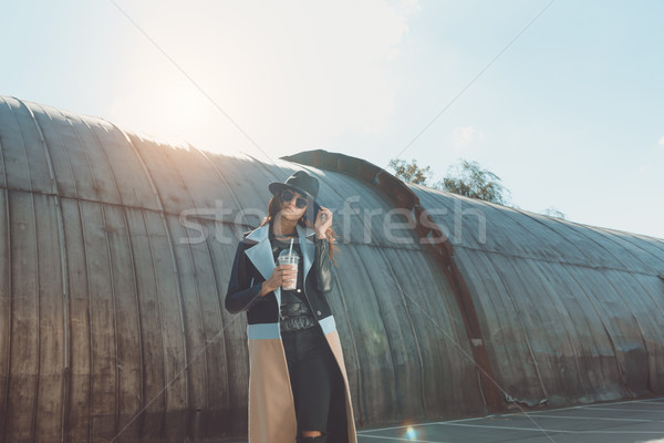  Woman in autumn outfit standing with milk shake Stock photo © LightFieldStudios