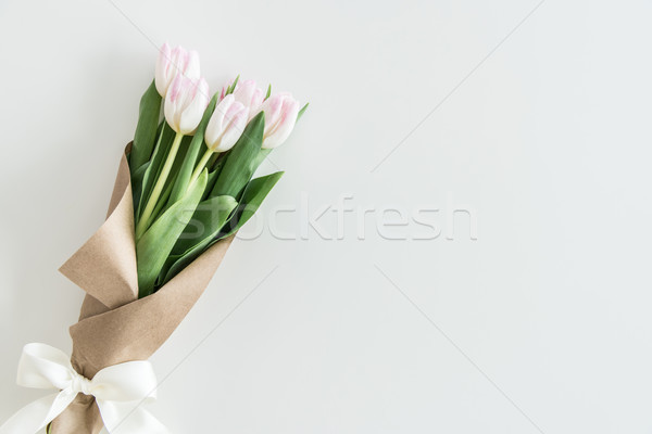 light pink tulips bouquet in kraft paper isolated on white with copy space, wedding flowers backgrou Stock photo © LightFieldStudios