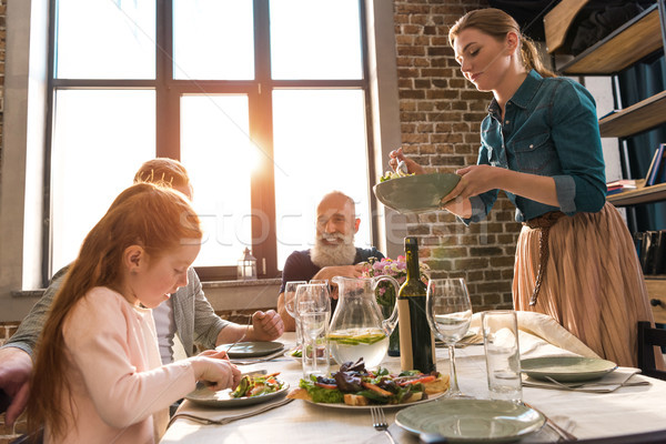 family having dinner at home Stock photo © LightFieldStudios