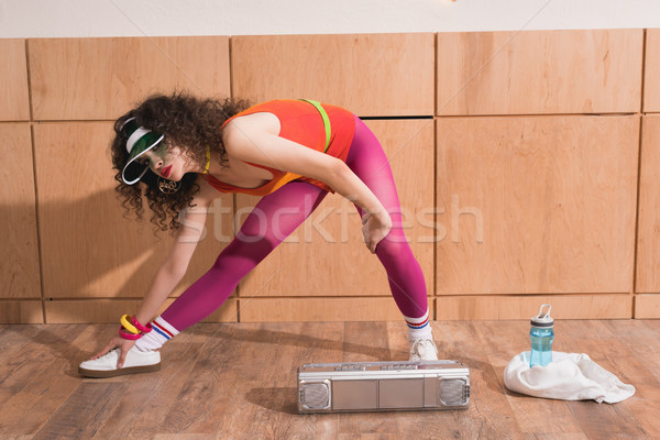 woman stretching before training Stock photo © LightFieldStudios