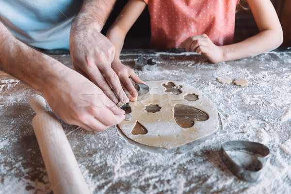 Stock photo: 'Close-up partial view of father and daughter preparing cookies together, Mothers day concept
