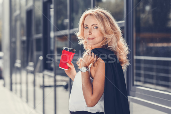 businesswoman with paper cup Stock photo © LightFieldStudios