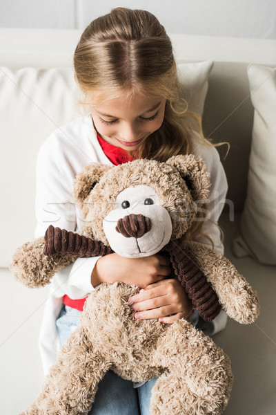 Kind Teddybär lächelnd Sitzung Sofa Stock foto © LightFieldStudios