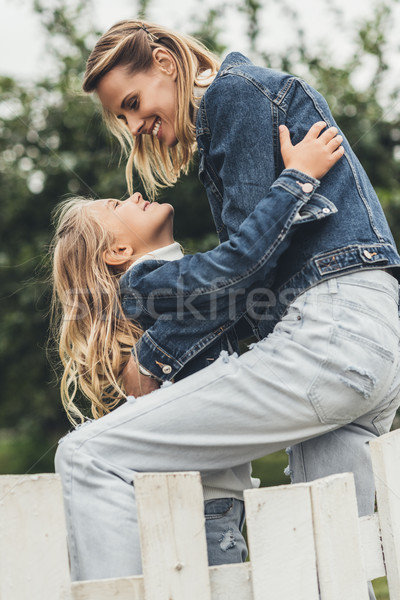 embracing mother and daughter  Stock photo © LightFieldStudios