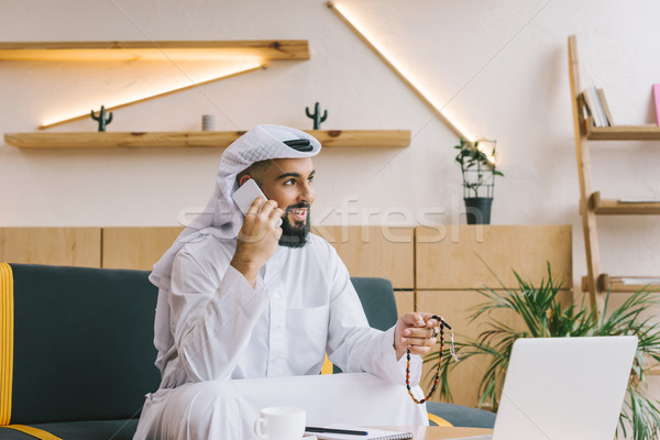 muslim businessman talking by phone Stock photo © LightFieldStudios