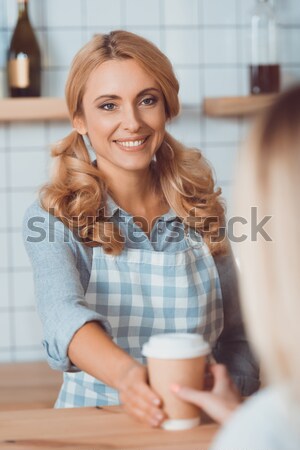 waitress and client with coffee to go Stock photo © LightFieldStudios
