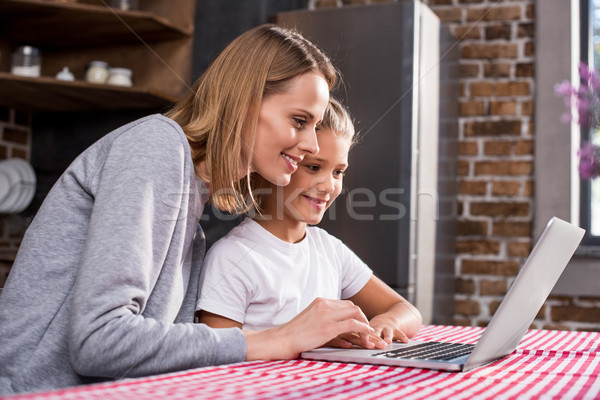 family using laptop Stock photo © LightFieldStudios