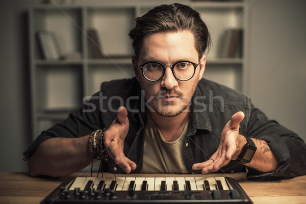 man with keyboard controller Stock photo © LightFieldStudios