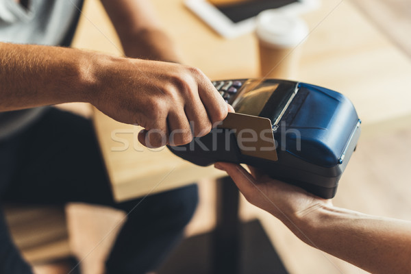 man paying with credit card Stock photo © LightFieldStudios