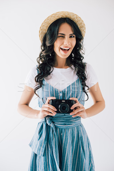 winking woman with photo camera in hands Stock photo © LightFieldStudios