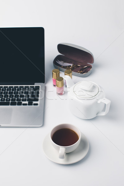 girly workplace with laptop and tea Stock photo © LightFieldStudios