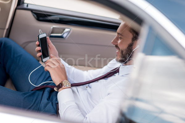 man listening music in car Stock photo © LightFieldStudios