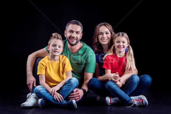 Happy family sitting together Stock photo © LightFieldStudios