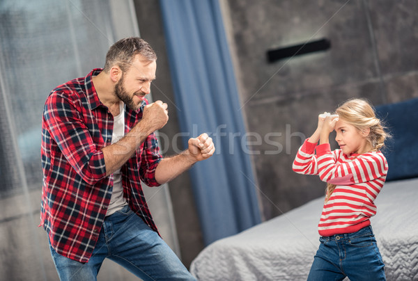 Father and daughter fooling around Stock photo © LightFieldStudios