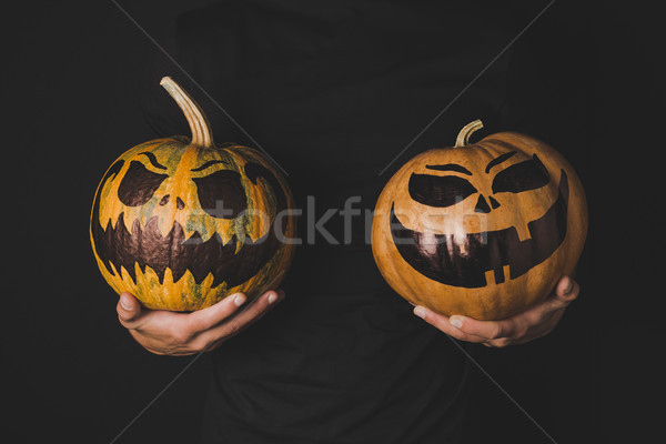 man with pumpkins in hands Stock photo © LightFieldStudios