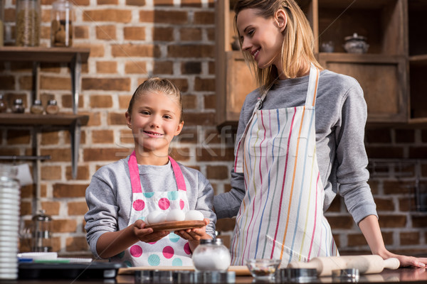 Stock photo: family with raw chicken eggs