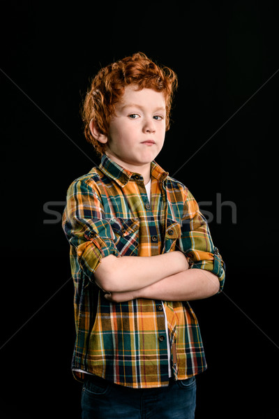 portrait of adorable redhead boy with crossed arms looking at camera isolated on black  Stock photo © LightFieldStudios