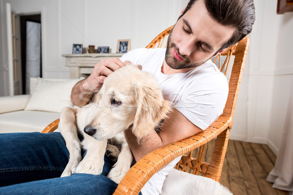 男 子犬 若い男 座って ロッキングチェア ストックフォト © LightFieldStudios