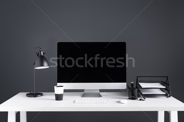 modern desktop computer with blank screen with keyboard and computer mouse at workplace  Stock photo © LightFieldStudios