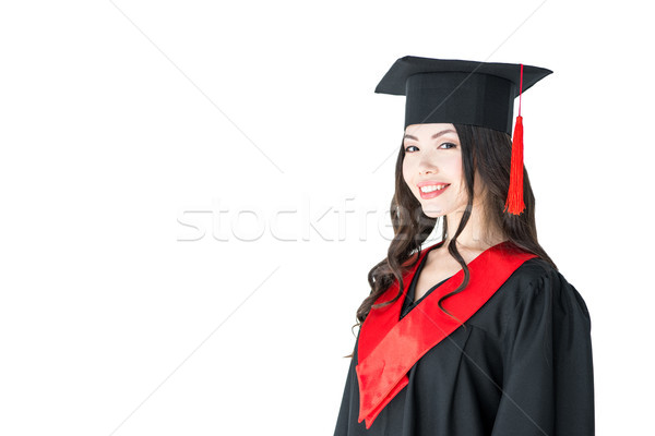 Beautiful young brunette woman in mortarboard smiling at looking at camera  Stock photo © LightFieldStudios