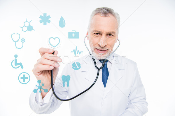 Stock photo: doctor with stethoscope and medical care icons