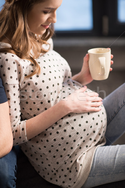 молодые беременная женщина Кубок чай прикасаться Сток-фото © LightFieldStudios