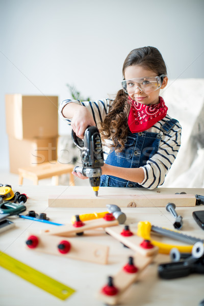Little girl with tools Stock photo © LightFieldStudios