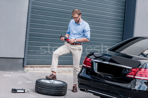 man changing car tire  Stock photo © LightFieldStudios