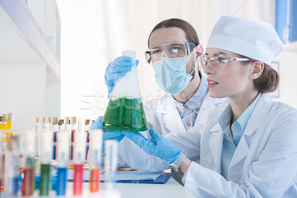 Chemists making experiment Stock photo © LightFieldStudios