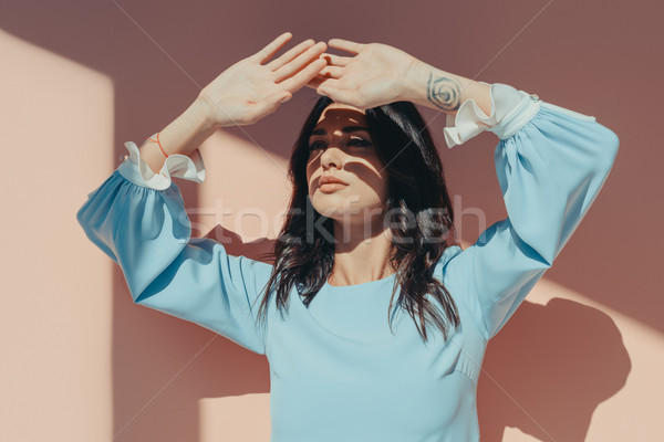Pensive woman with hands against eyes Stock photo © LightFieldStudios