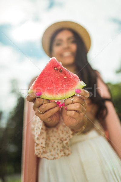 girl holding slice of watermelon Stock photo © LightFieldStudios