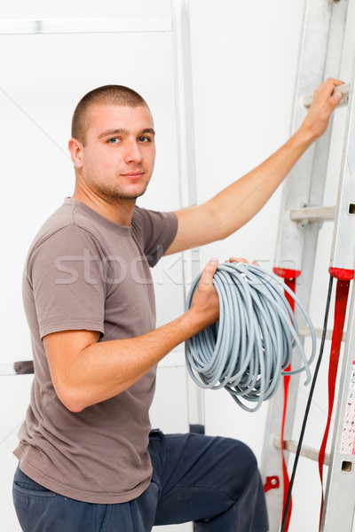 Elektricien man klimmen bouw kabel industriële Stockfoto © Lighthunter