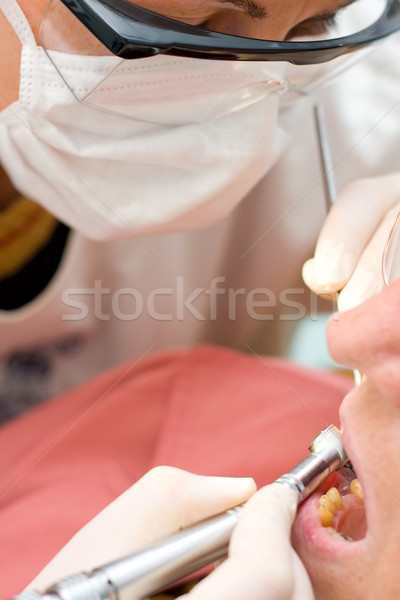 Dentist chiseling Stock photo © Lighthunter