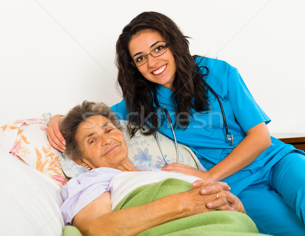 Nővér gondoskodó idősebb mosolyog beteg öregek otthona Stock fotó © Lighthunter