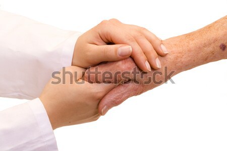 Segít szűkölködő orvos tart öreg kéz Stock fotó © Lighthunter