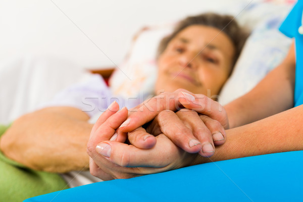 Stock photo: Caring Nurse Holding Hands