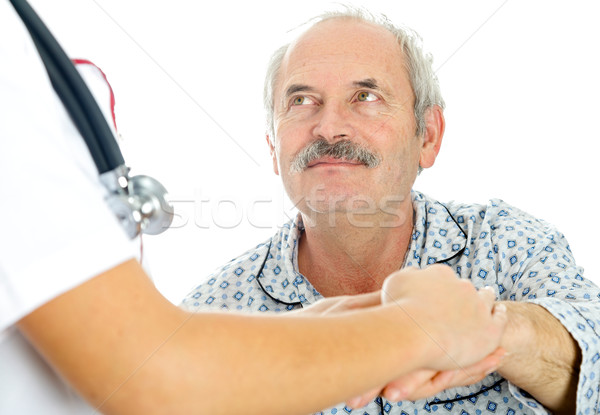 Pillantás orvos tart kéz idős férfi Stock fotó © Lighthunter