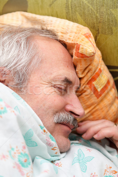 Spokojny drzemka starszych człowiek bed Zdjęcia stock © Lighthunter