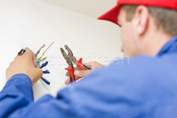 Hnadyman working with wires Stock photo © Lighthunter