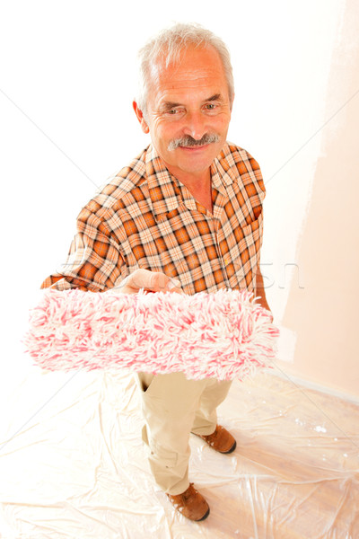 Senior man with paint roller Stock photo © Lighthunter
