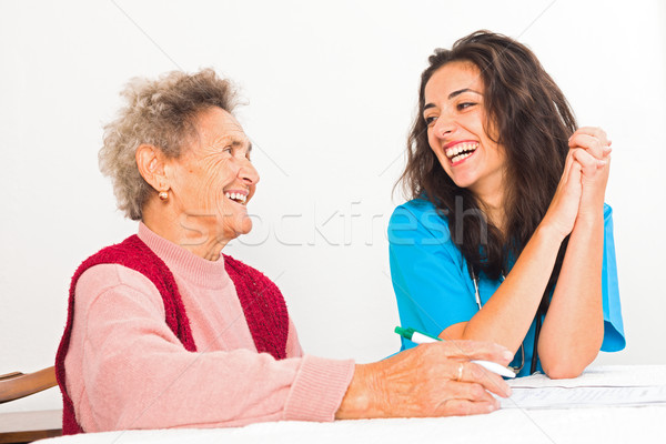 Lachend ouderen verpleegkundige gelukkig dame verzorger Stockfoto © Lighthunter