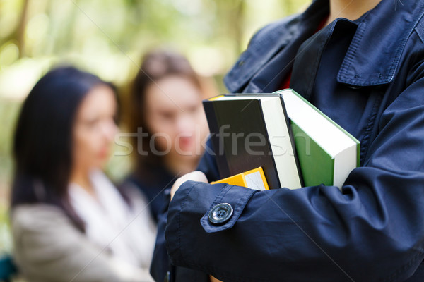 [[stock_photo]]: éducation · diligent · étudiant · extérieur · livres · mains