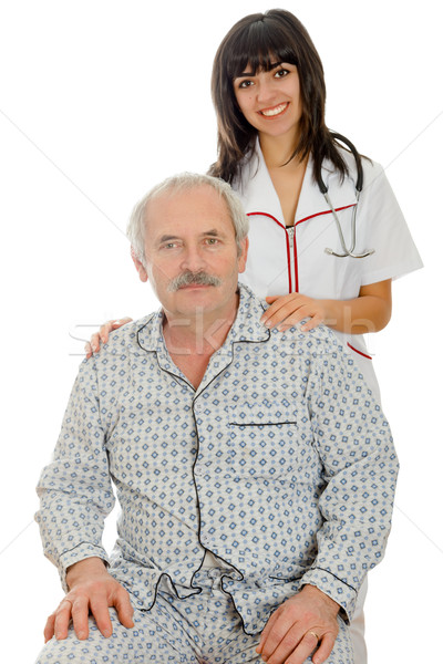 Senior sanitaria giovani sorridere gentilmente piedi Foto d'archivio © Lighthunter