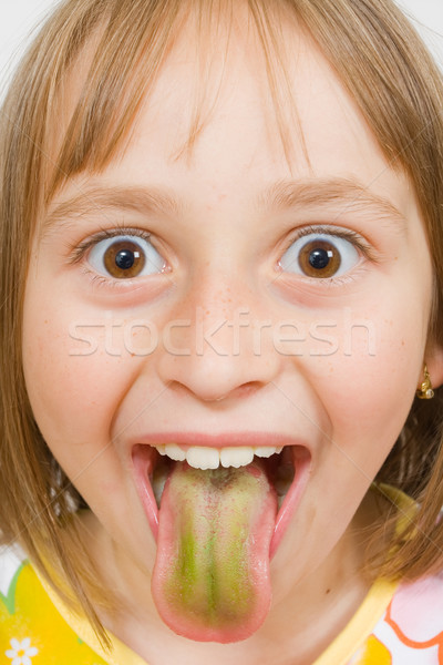 Grimasz kislány készít vicces arc mutat színes Stock fotó © Lighthunter