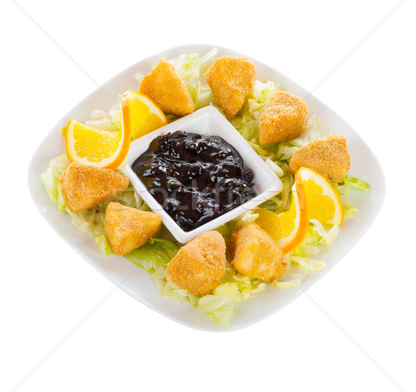 Fryed cheese in bread crumbs with blueberry jam Stock photo © Lighthunter