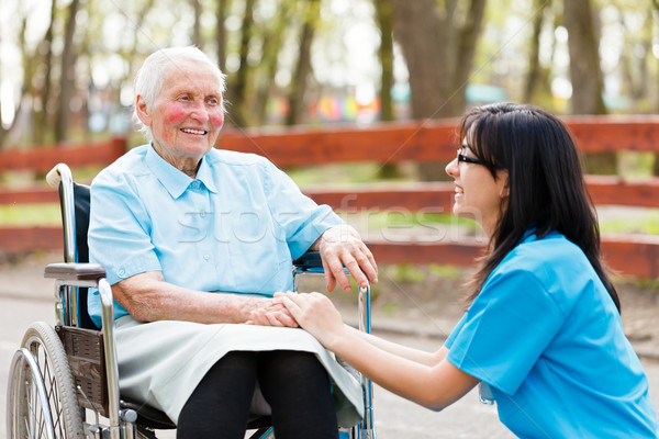 Stock photo: Chatting with Elderly Lady