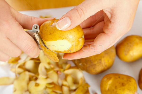 Peeling potato Stock photo © Lighthunter
