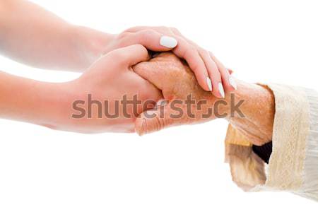 Segít szűkölködő idős kezek fiatal személy Stock fotó © Lighthunter