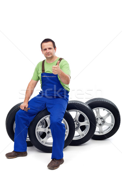 Car mechanic with a set of new tires Stock photo © lightkeeper