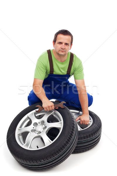 Car mechanic with new tires Stock photo © lightkeeper